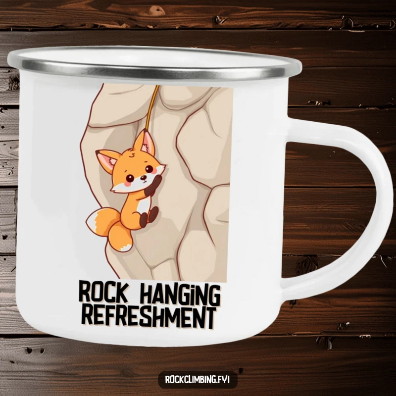 Funny fox dangling from a rock face by a tiny rope on a durable camping mug, ideal for playful outdoor enthusiasts.