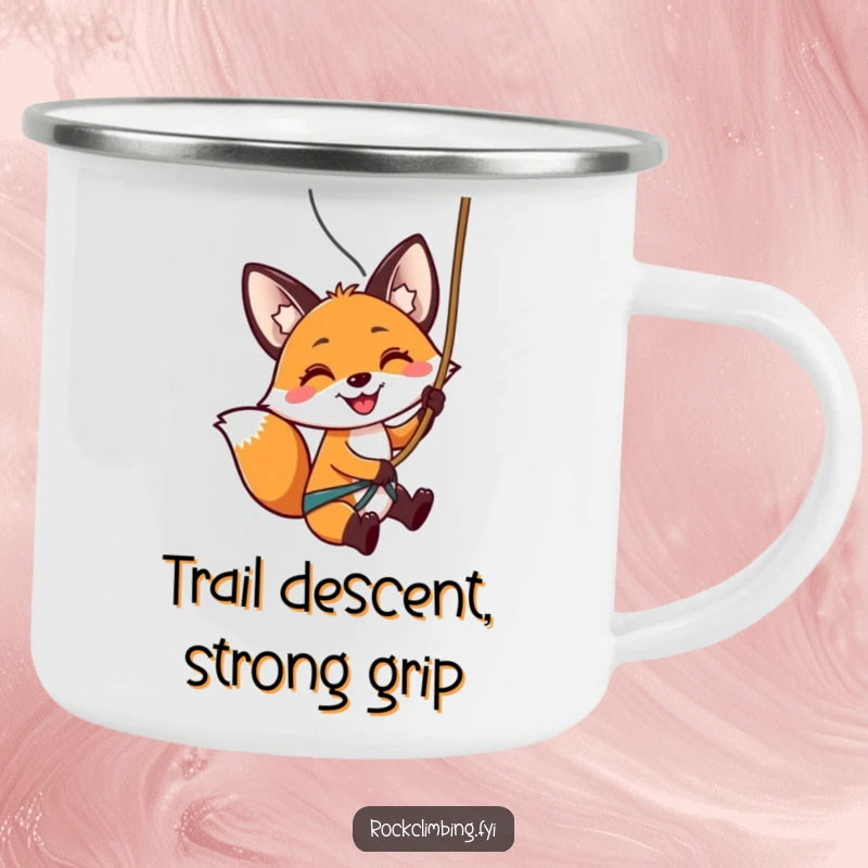 Funny camping mug with a smiling fox rappelling down a rock face, embodying outdoor thrills and humorous excitement.