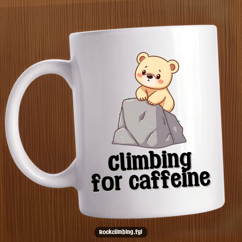 Funny mug showing a determined bear cub using its little paws to bravely scale a small cliff face, embodying ambition.