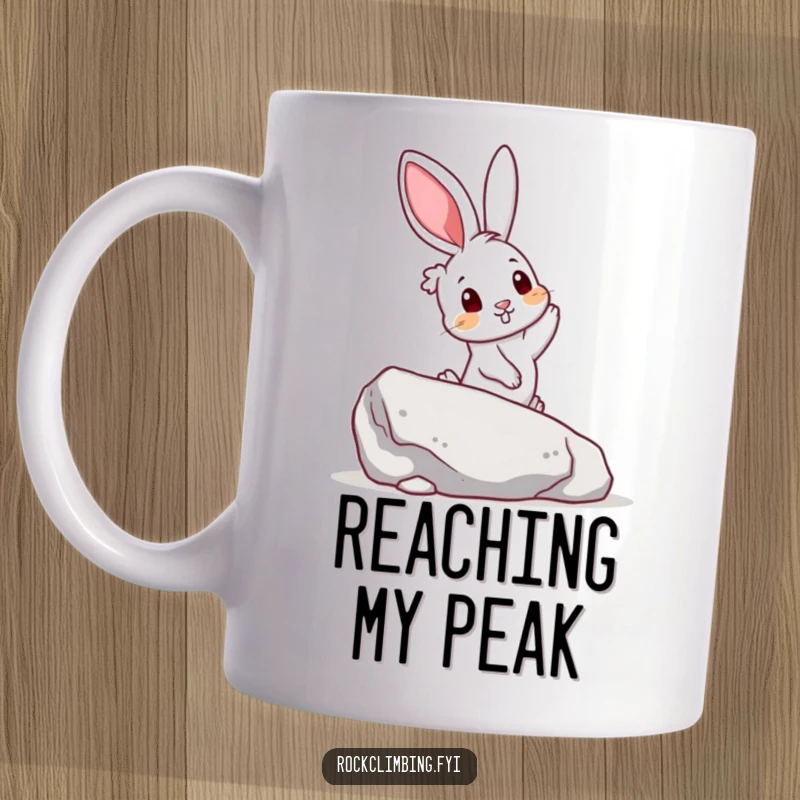 Funny mug showing a curious rabbit reaching for a colorful handhold on a boulder, embodying exploration and joy.