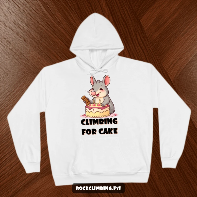 Funny hoodie with a smiling aardvark enthusiastically hammering pitons into a cake, providing comfort for your own ambitious quests.
