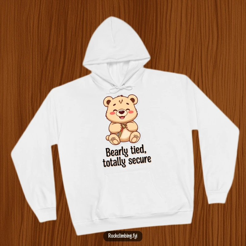 Funny bear cub hoodie, a smiling cub carefully secures a carabiner onto a knot, indicating a love for climbing and fun.