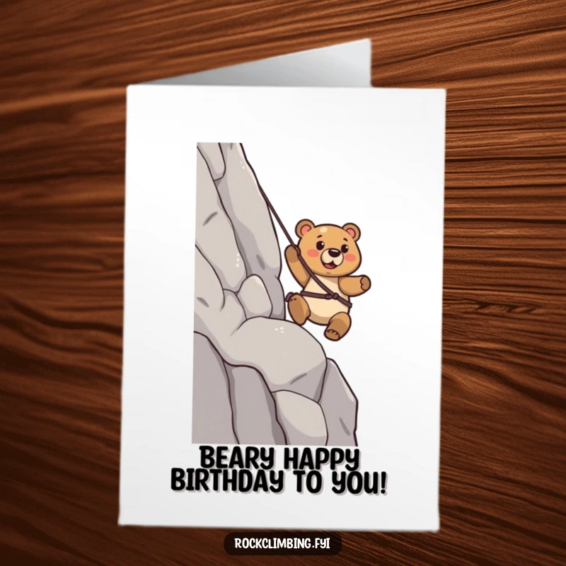 Funny Free Printable Birthday Card: Determined bear confidently rappelling down a steep cliff face.