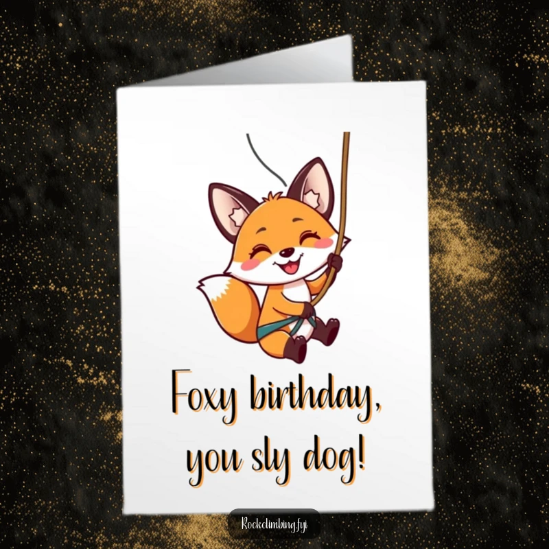 Funny Free Printable Birthday Card: A smiling fox rappelling down a rock face with a rope, celebrating a birthday adventure.