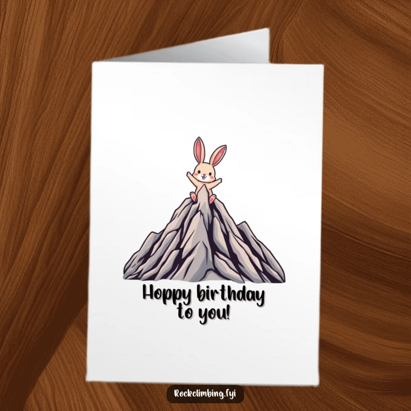 Funny Free Printable Birthday Card: A rabbit triumphantly reaching a mountain summit, celebrating success.