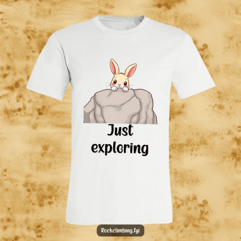 Funny t-shirt depicting a curious rabbit peeking over the edge of a rocky outcrop, showcasing exploration and woodland charm.
