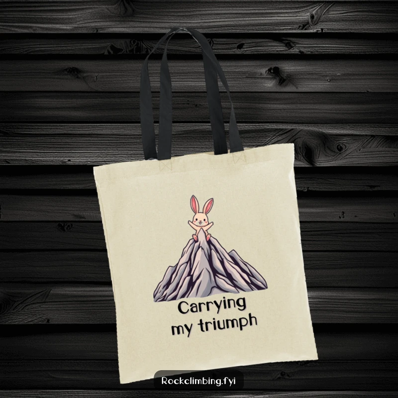 Funny tote bag showing a joyful rabbit triumphantly reaching the summit of a stylized mountain, celebrating a grand quest.