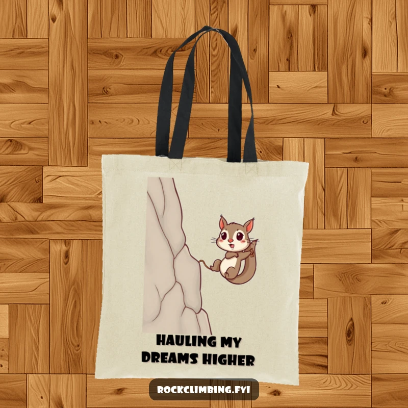 Funny squirrel tote bag featuring a small squirrel with a rope, impressively scaling a high, steep cliff wall.